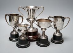 Five assorted 1920's/1930's silver two handled presentation trophy cups, all with engraved