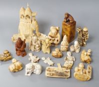 A collection of various ivory carvings including netsuke, a soapstone seal and carved wood netsuke