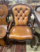 An early Victorian mahogany open armchair upholstered in tan leather, width 60cm, depth 42cm, height