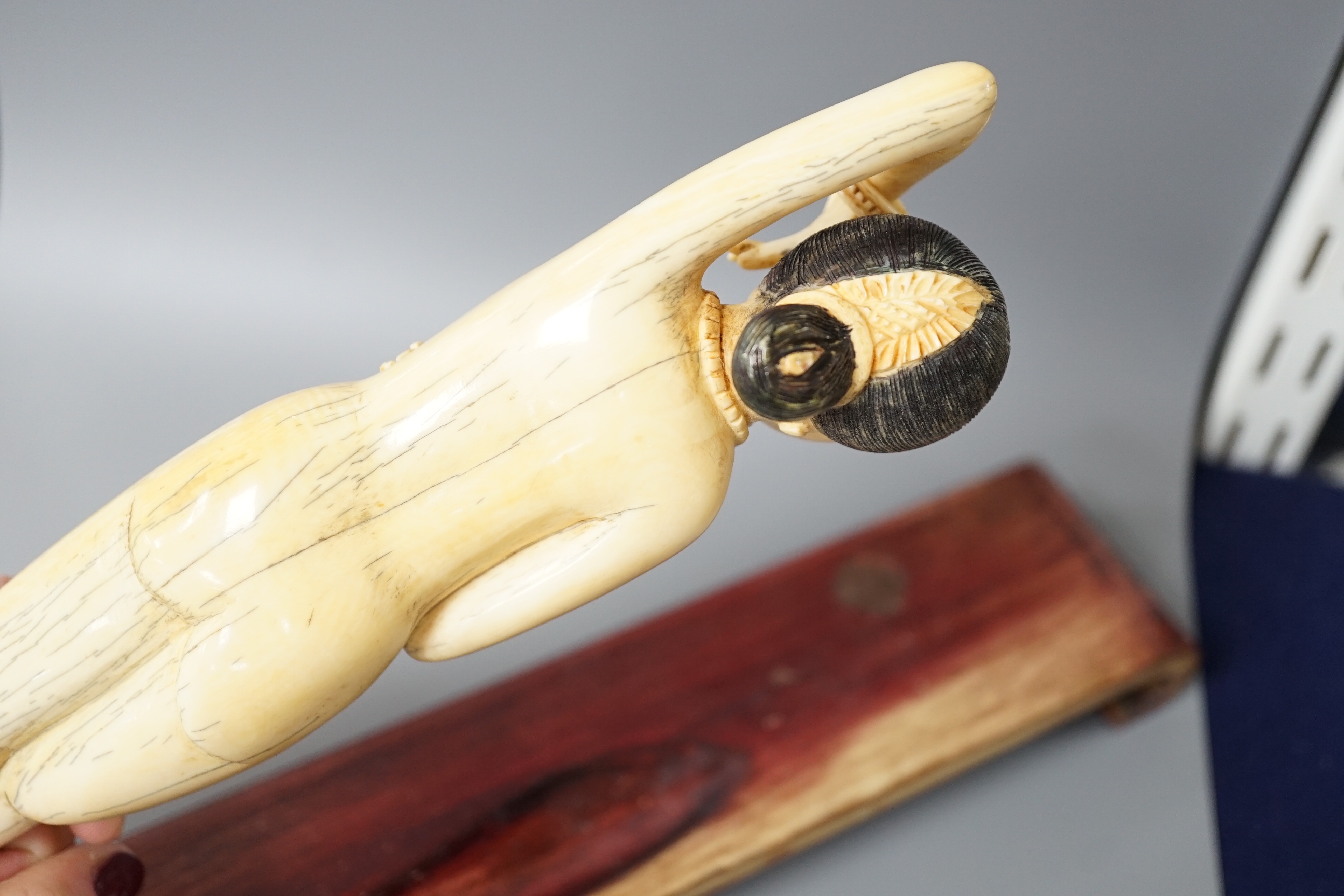 A Chinese carved ivory medicine figure, late 19th/early 20th century, wood stand. 25cm excl stand - Image 5 of 5