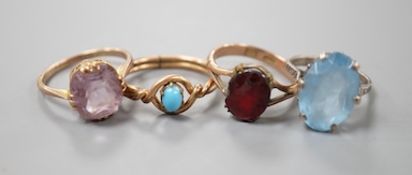 Two 9ct dress rings and two other rings including gilt metal and paste set.