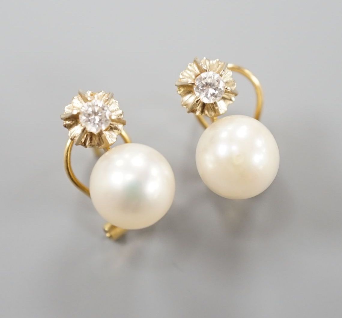 A modern pair of Italian 750 yellow meta, culture pearl and diamond set earrings, 14mm, gross weight