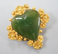 A yellow metal mounted nephrite heart shaped brooch, 41mm, gross weight 11.9 grams.