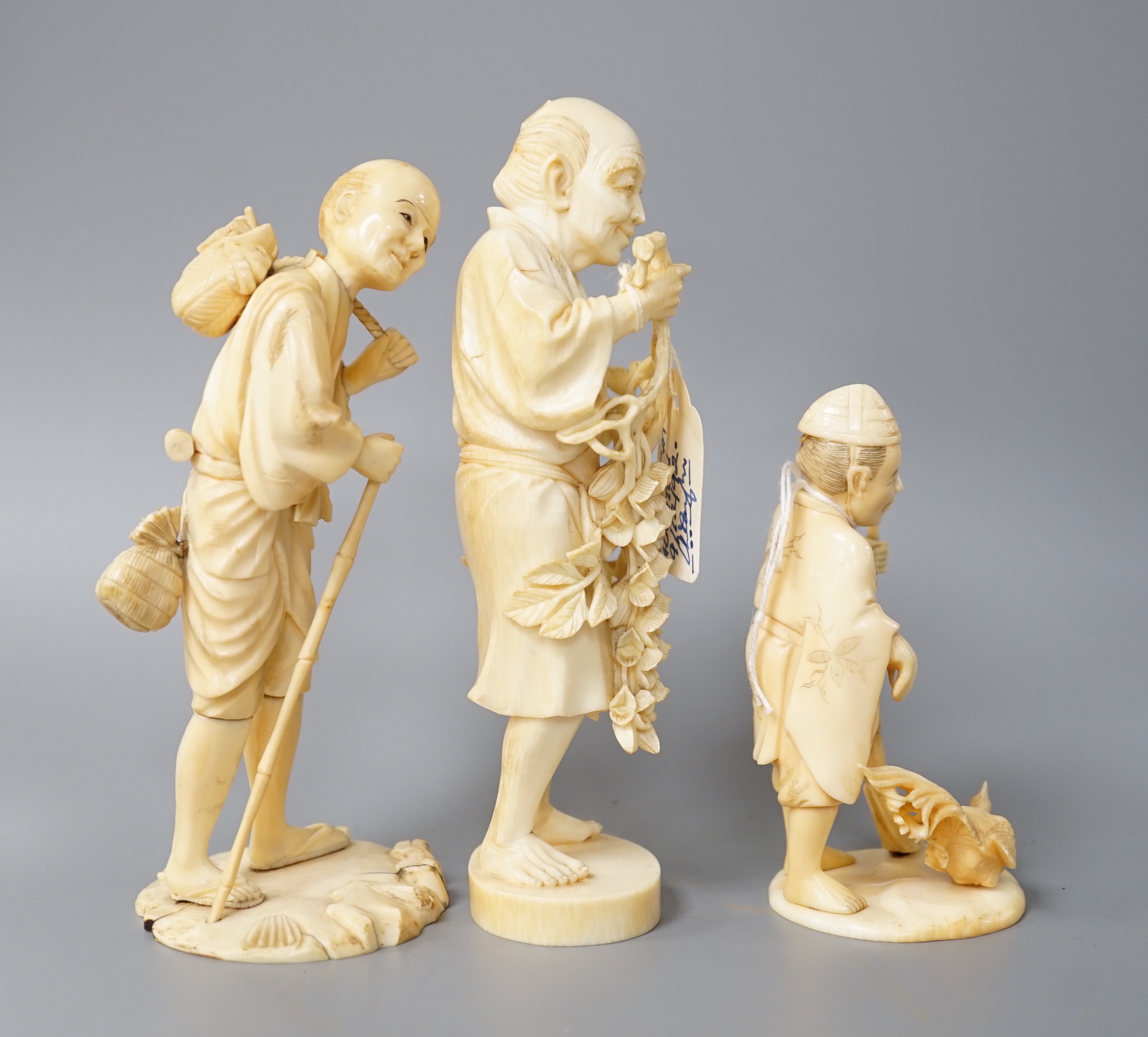 A 19th century Japanese ivory okimono of a gentleman holding a branch, another sectional figure of a - Image 2 of 6