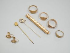 Four assorted 9ct rings including a Victorian buckle ring, 14 grams, two stick pins including part