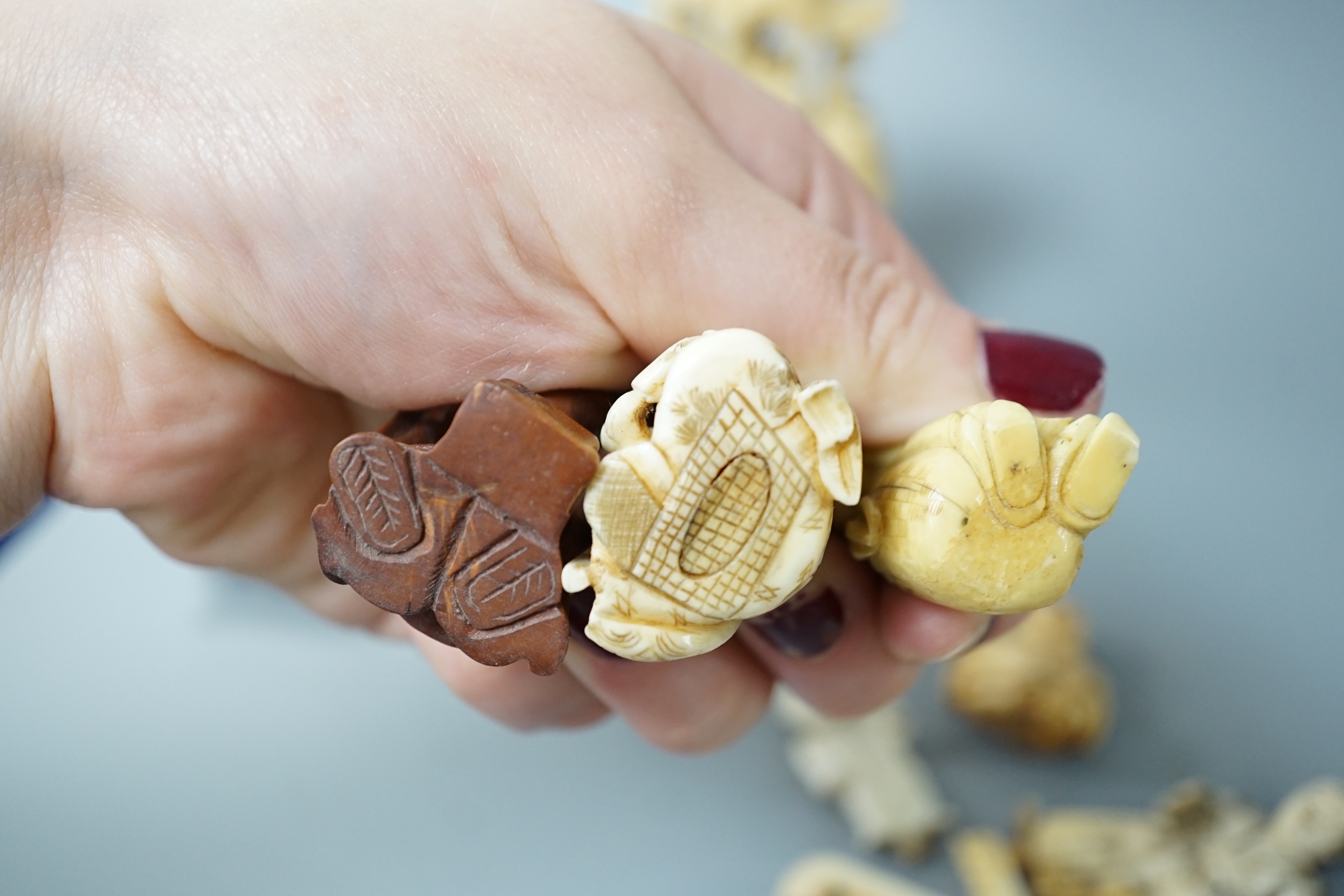 A collection of various ivory carvings including netsuke, a soapstone seal and carved wood netsuke - Image 8 of 8