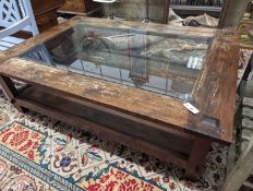 A large rectangular glass top hardwood two tier coffee table, length 160cm, width 110cm, height