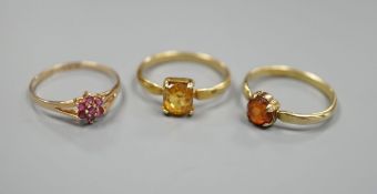 Two yellow metal and gem set rings, including garnet and citrine and a 9ct gold and gem set