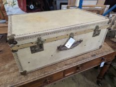 An early 20th century brass mounted vellum suitcase, length 75cm, depth 48cm, height 30cm