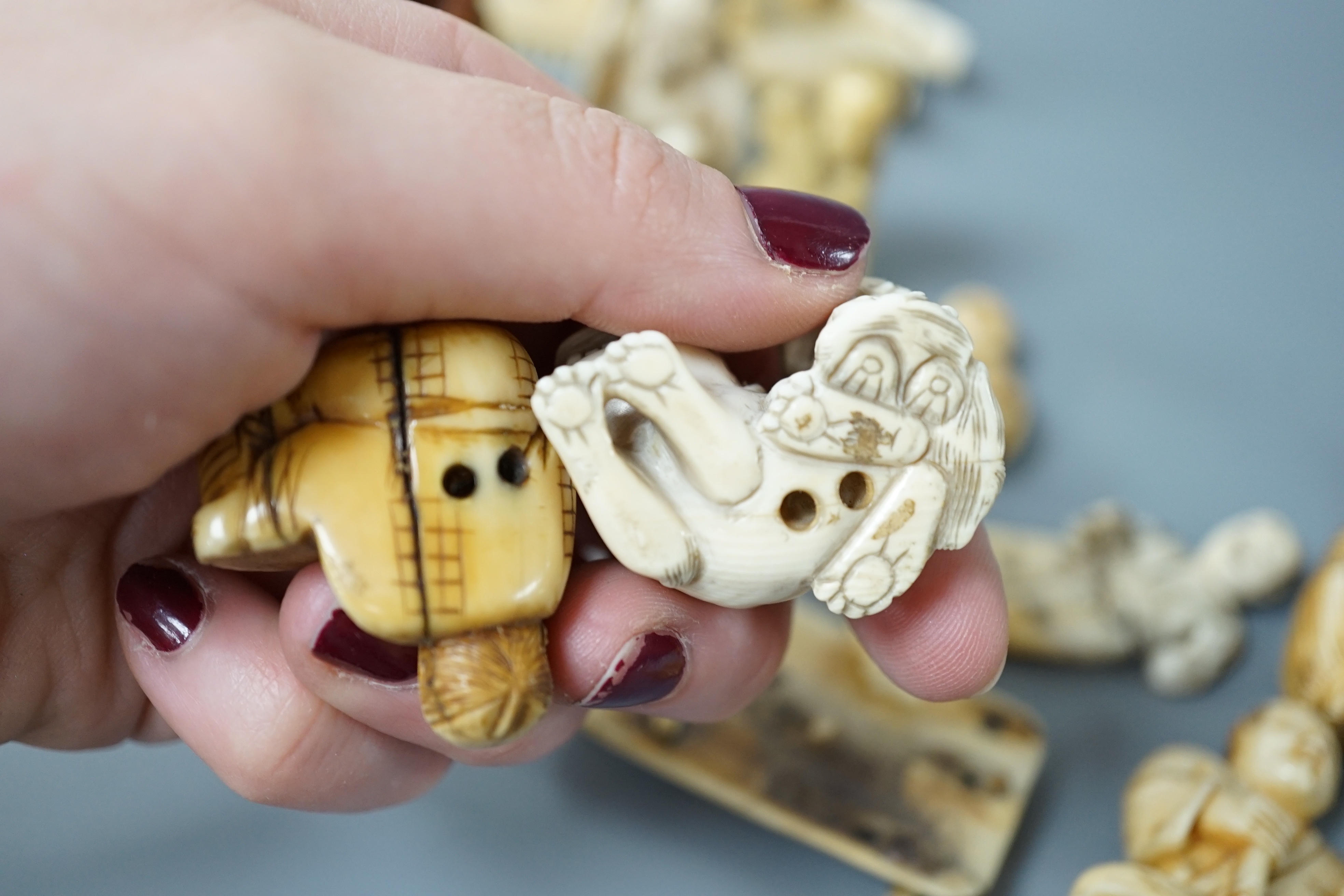 A collection of various ivory carvings including netsuke, a soapstone seal and carved wood netsuke - Image 7 of 8