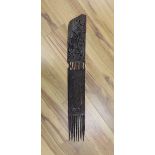 An African carved hardwood comb, Swahili83 cms long.
