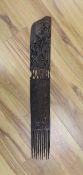 An African carved hardwood comb, Swahili83 cms long.