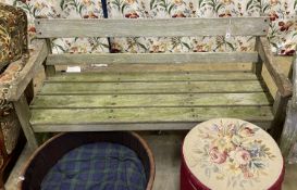 A weathered teak garden bench, length 150cm, depth 54cm, height 78cm
