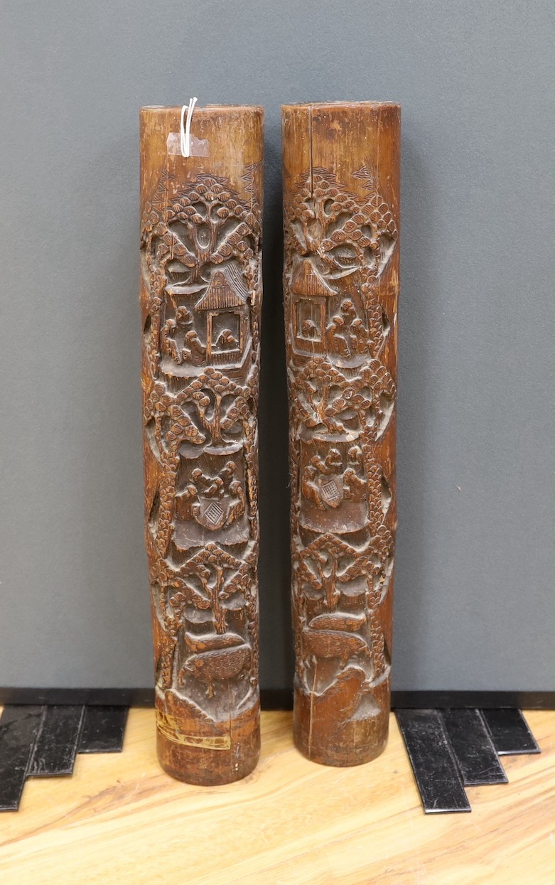 A pair of early 20th century Chinese carved bamboo chutes70cm