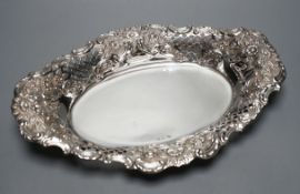 A late Victorian pieced an embossed silver oval fruit bowl, George Howson, Sheffield, 1900, 31.3 cm,