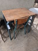 A child's oak and painted metal desk, length 59cm, depth 45cm, height 64cm and a chair