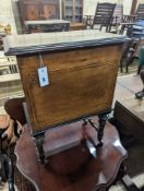 A late Victorian inlaid walnut enclosed Canterbury, width 48cm, depth 31cm, height 68cm