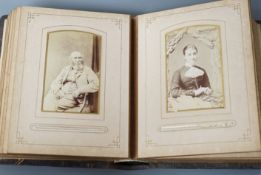 A Victorian portrait photograph album in clasp bound book containing cabinet cards