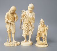A 19th century Japanese ivory okimono of a gentleman holding a branch, another sectional figure of a