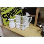 Four Victorian Parian relief-moulded jugs, all battle-related, tallest 24cm