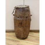 A 19th/20th century Ashanti breasted drum,61 cms high.