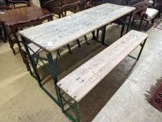 A rectangular pine and painted wrought iron folding garden trestle table, length 150cm, depth
