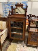 An Edwardian satinwood banded mahogany mirrored back music cabinet, width 56cm, depth 36cm, height