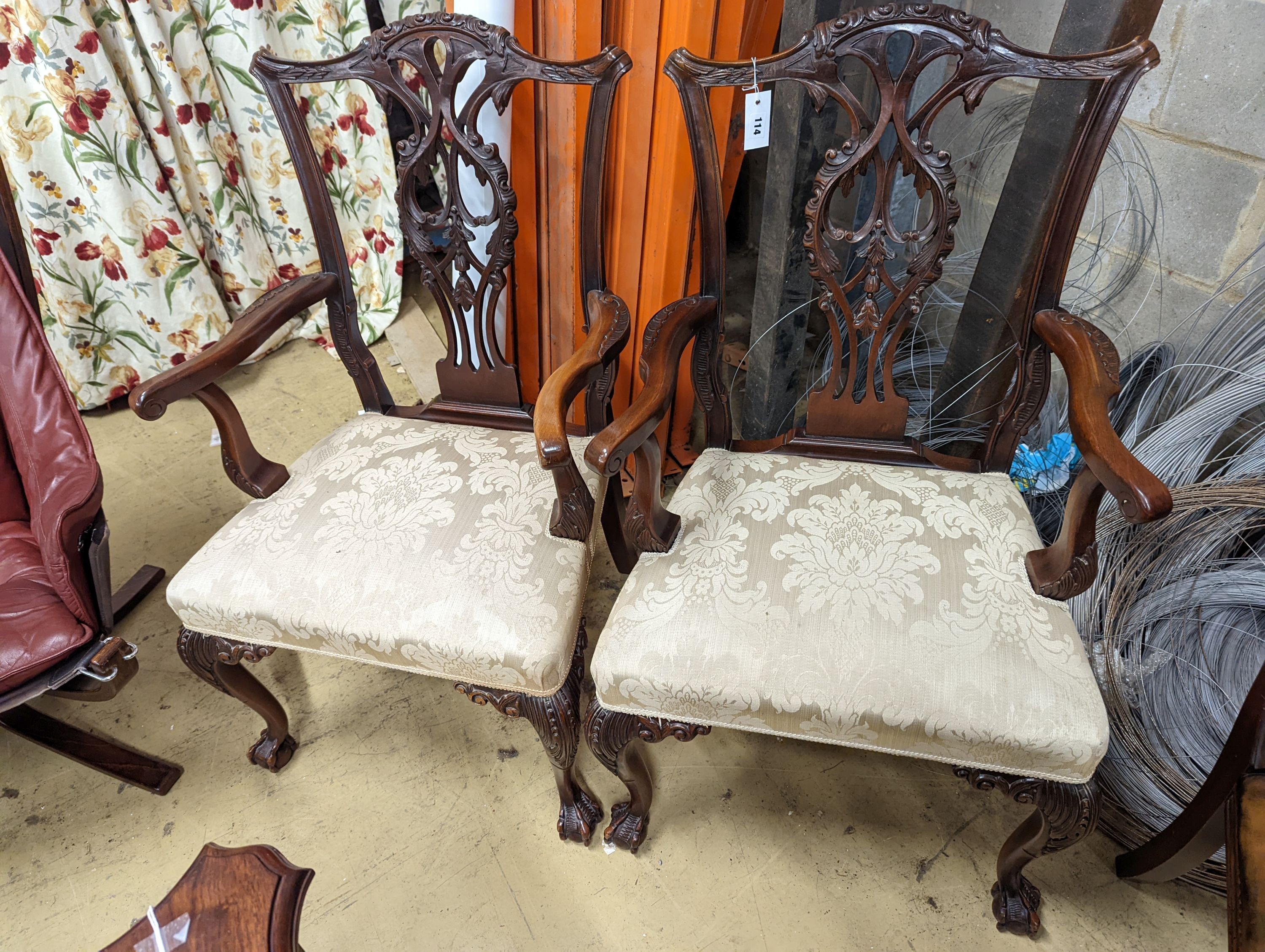 A pair of Chippendale revival mahogany elbow chairs, width 60cm, depth 50cm, height 102cm