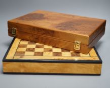 A cased Backgammon set and a chess set with chess-board top and drawers for chess pieces,chess box