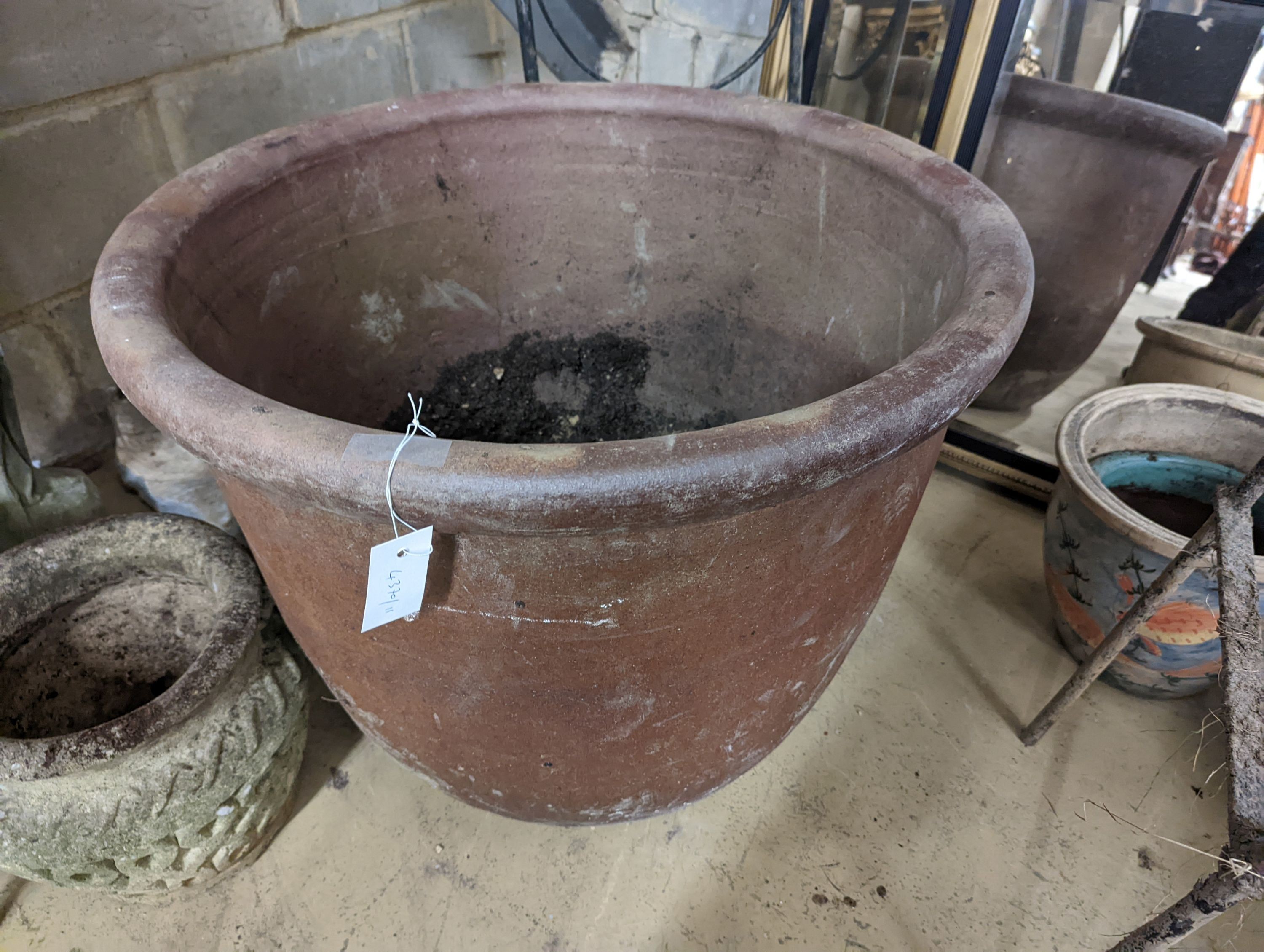 A large circular glazed earthenware garden planter, diameter 65cm, height 54cm