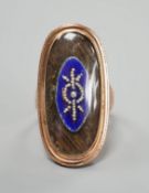 A 19th century yellow metal, blue enamel, seed pearl and plaited hair set oval mourning ring, size