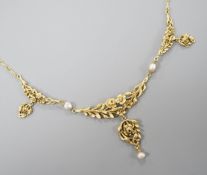 An early 20thcentury French yellow metal (18ct poincon mark) and baroque pearl set drop pendant