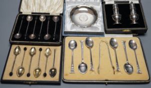 Two cased sets of six silver coffee spoons including enamel(a.f.) and bean end and three other cased