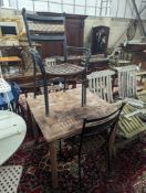 A square teak garden table, width 89cm, height 74cm and four metal garden chairs