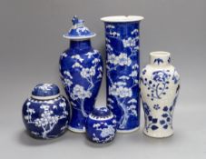 Five 19th century blue and white Chinese ceramics including vases and gingers jars with covers,