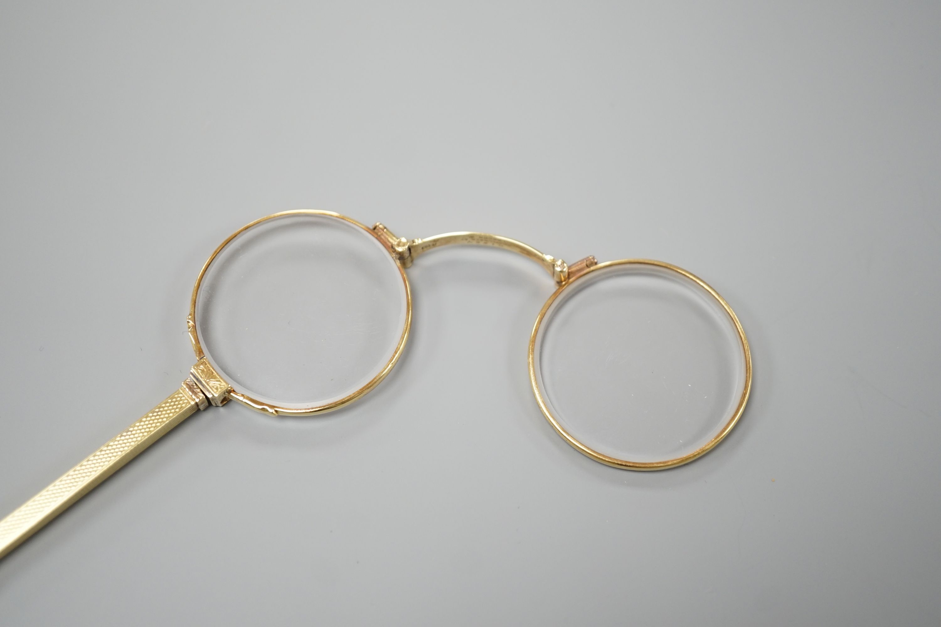 A pair of Edwardian 15ct lorgnettes, by Dixie, 20 Welbeck Street, London, with engine turned handle, - Image 2 of 4