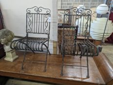 A pair of wrought iron folding garden chairs, width 38cm, height 89cm