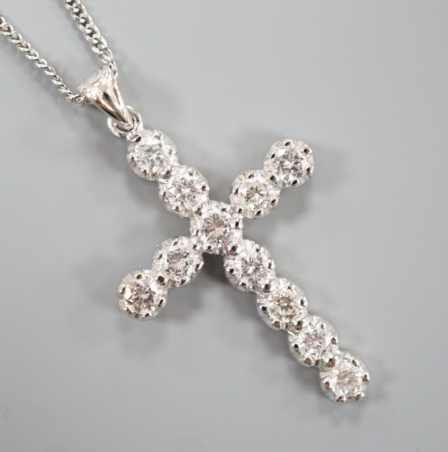 A modern 18ct white gold and diamond set cross pendant, 39mm, on an 18ct white gold chain, 44cm,