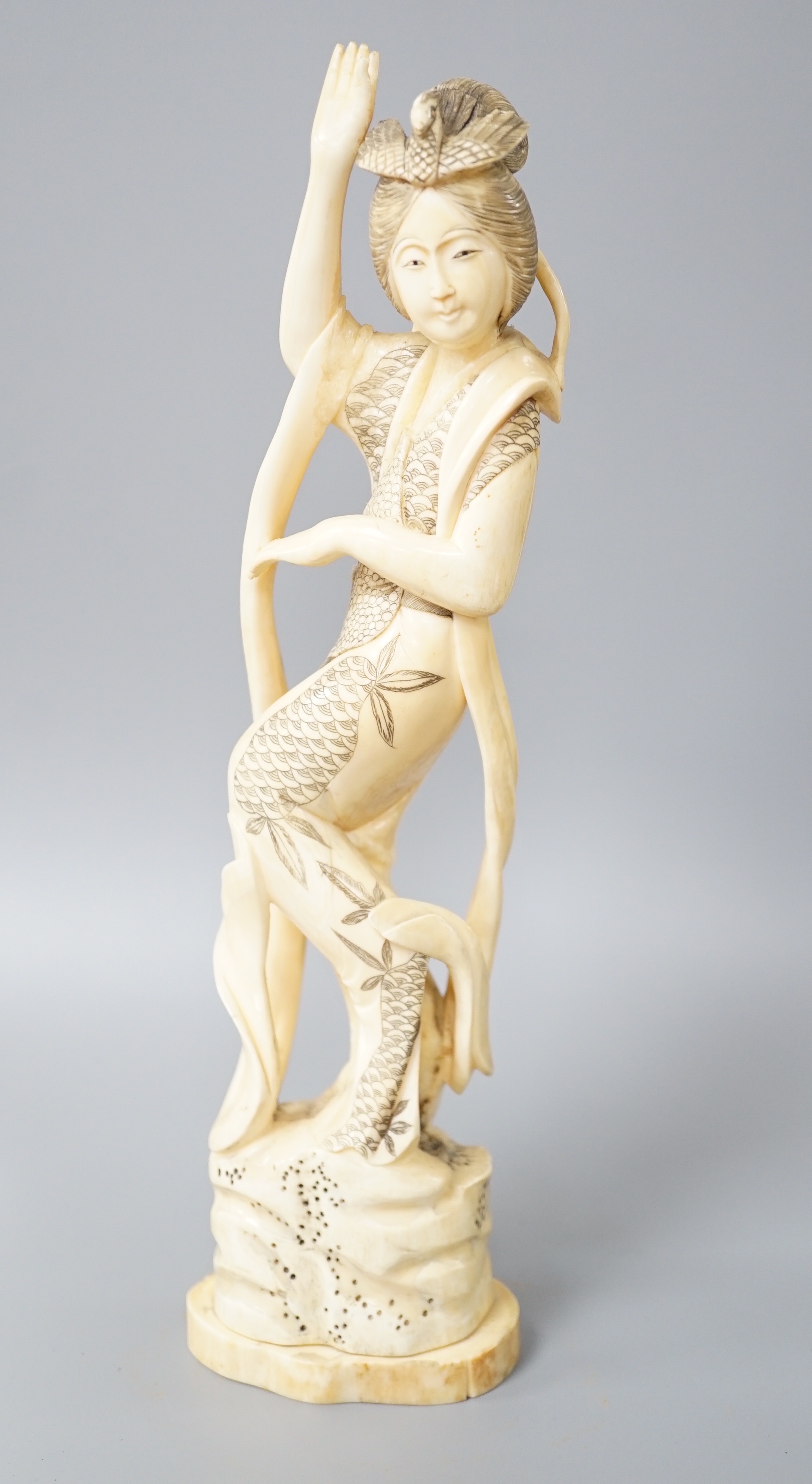 A Japanese walrus ivory figure of Seiobo, the Queen Mother of the West, early 20th century 28cm