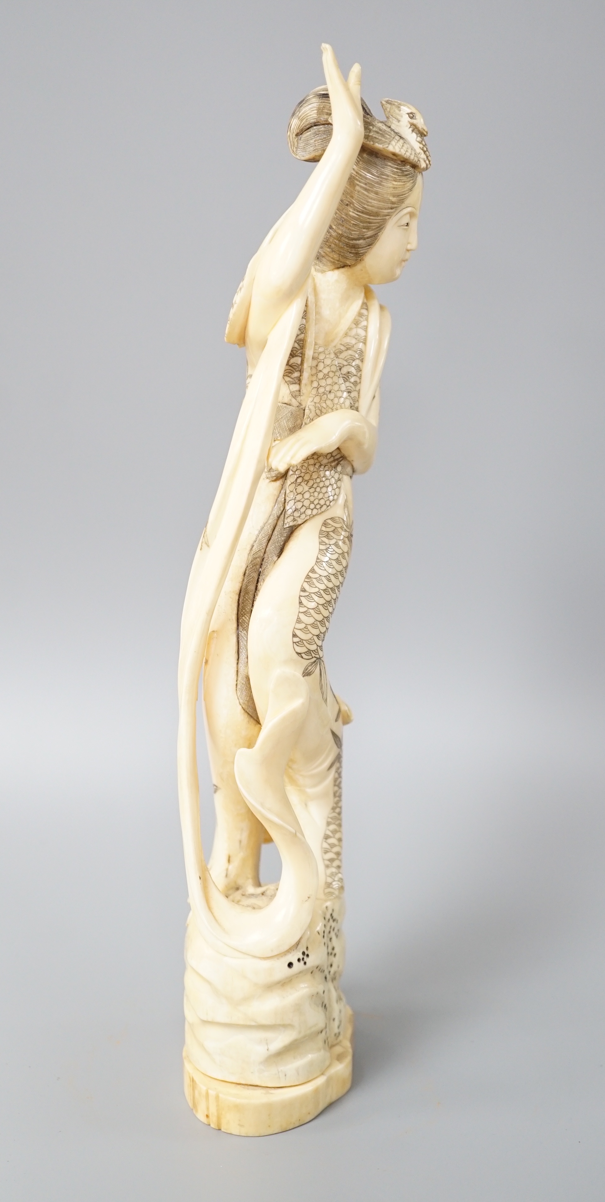 A Japanese walrus ivory figure of Seiobo, the Queen Mother of the West, early 20th century 28cm - Image 2 of 7