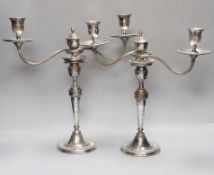 A pair of Sheffield plate two-branch twin-light candelabra,37 cms high.