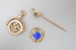 A 1920's pendant, 26mm, a yellow metal and split pearl set horseshoe stick pin and a damaged