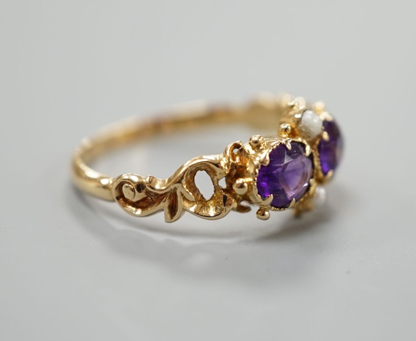 A late Victorian yellow metal, two stone amethyst and two stone seed pearl set cluster ring, size L, - Image 2 of 4