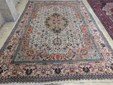 A Tabriz ivory ground carpet, 425 x 306cm