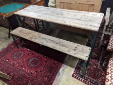 A rectangular pine and painted wrought iron folding garden trestle table, length 150cm, depth