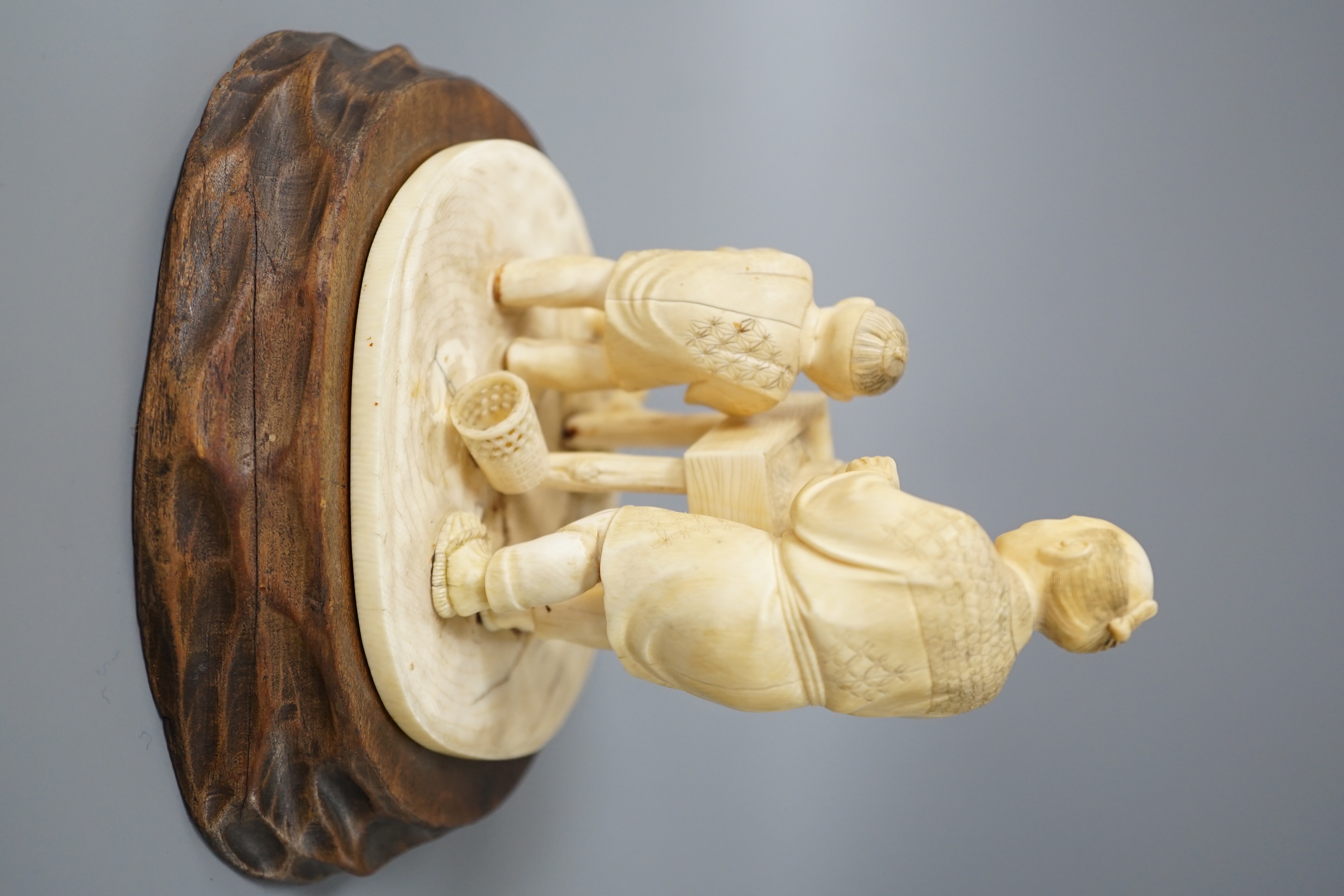 A Japanese ivory okimono of man and boy at a grindstone, Meiji period, signed, wood stand. 15cm - Image 3 of 6