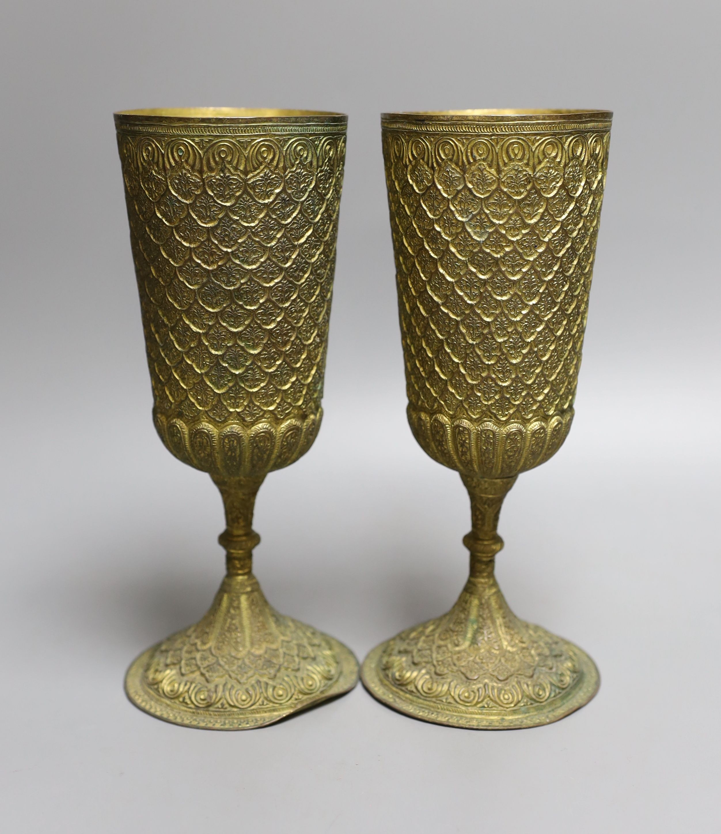 A pair of ornate gilt metal goblets,22cms high.