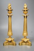 A pair of Louis XVI style ormolu candlesticks with torched stoppers - 32cm high