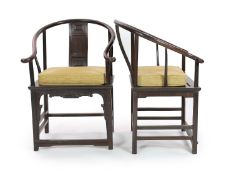 A pair of Chinese tielimu horseshoe-back armchairs, 18th/19th century,each central panelled back