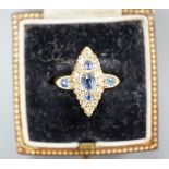 An Edwardian 18ct gold, sapphire and diamond set marquise set cluster ring, size K, gross weight 3.2